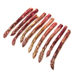 Purple asparagus  isolated on a white studio background.