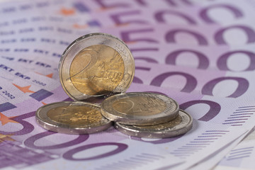 Euro coins on banknotes