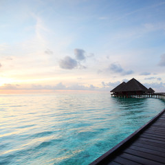 maldivian houses on sunrise