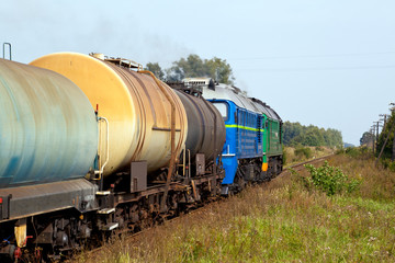 Fototapeta na wymiar Freight train passing the countryside