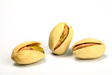 Toasted pistachios on white background