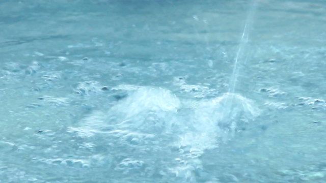 Jet of water running vividly generating ripple