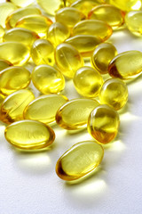 Cod liver oil pills on white