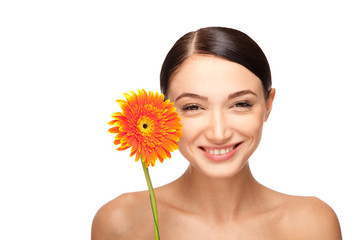 Portrait of beautiful  young woman with a flower