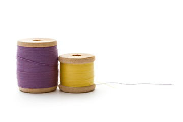 Thread bobbins on the white background