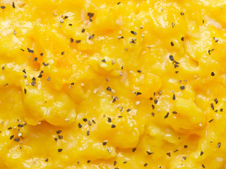 close up of scrambled eggs with pepper food background
