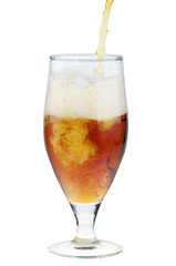 Alcohol dark beer pouring into a glass isolated over white.