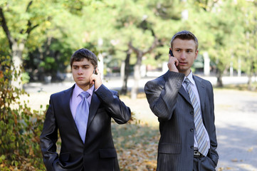 two businessmen talking on the phone