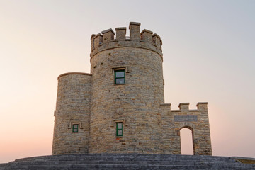 O'Briens Tower on Cliffs of Moher at sunset