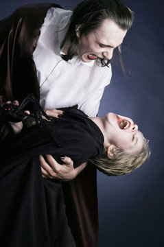 Adult vampire and his young victim