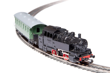 Toy steam train pulling one carriage