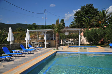 hotel with swimming pool and sun loungers