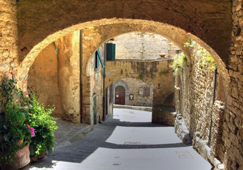 Arch in the street of an old village, Italy