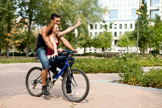 couple riding a bicycle