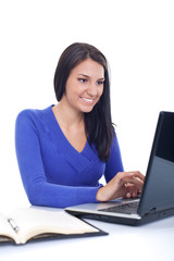 smiling girl working on laptop