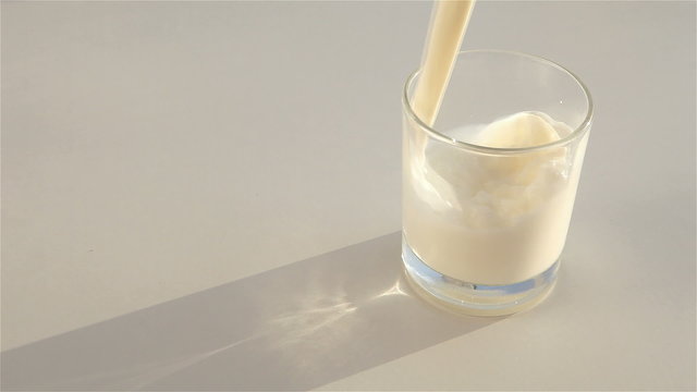 milk poured into a transparent glass