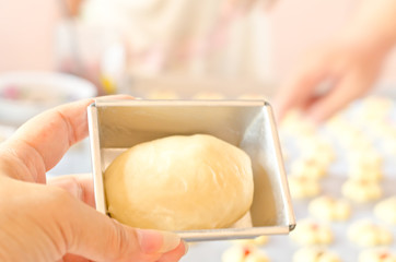 Hand showing a bread to baking homemade