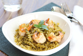 Pasta with pesto sauce and prawn