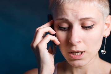 The young girl speaks on the phone