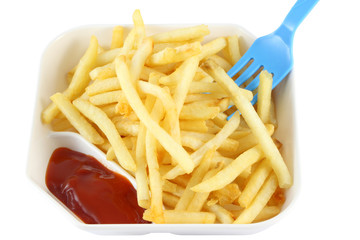 French fries with red ketchup and blue spoon on top right.