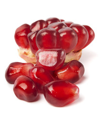 Ripe pomegranate piece isolated on white background