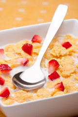 cornflakes with milk and strawberries