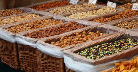 A Market Stall Selling a Variety of Nuts.