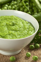 Fresh green pea soup with pea seeds