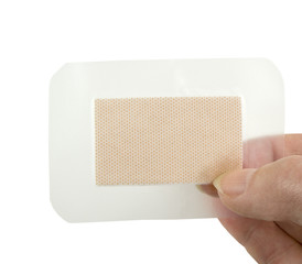 holding a waterproof clear bandage on a white background