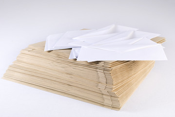 Pile of envelopes over white background. Not isolated.