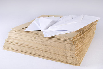 Pile of envelopes over white background. Not isolated.