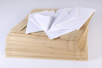 Pile of envelopes over white background. Not isolated.