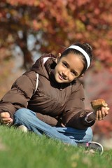 Girl Eating Sandwich at the Park