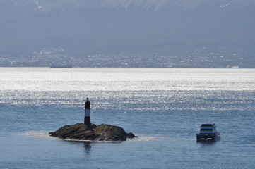 a lighthouse with boat