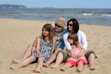 Family looking on the beach side