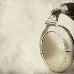 Professional stereo headphones over grunge background