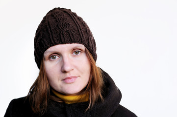 Lovely brunette woman in brown knitted hat