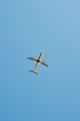 Plane flying through blue sky