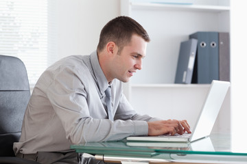 Businessman working concentrated on his laptop