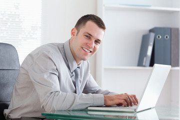Businessman typing on his laptop