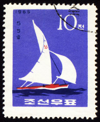 Yacht in a sea on post stamp