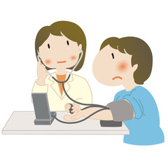 血圧を測る女性──病院で