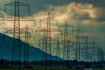 Electricity towers and cabels on cloud background