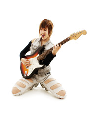 Punk Rockstar holding a guitar kneeling isolated in white