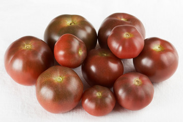 Several brown tomatoes. Grade 