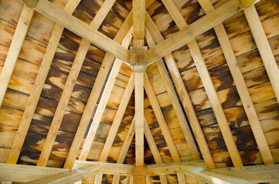 sunlight creeping into a timber roof interior