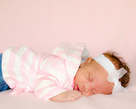 Portrait of African-American infant baby girl sleeping