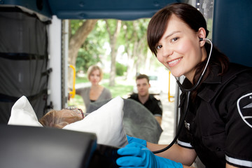 Paramedic in Ambulance with Patient