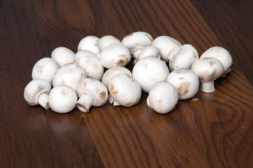Paris mushrooms on wooden table