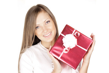 beautiful young smiling woman holding christmas gift